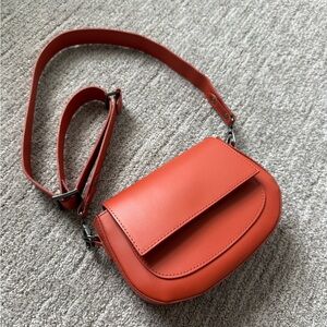 Sleek Orange Crossbody Bag with Minimalist Design